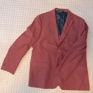 Men’s sports coat. A dark salmon color.